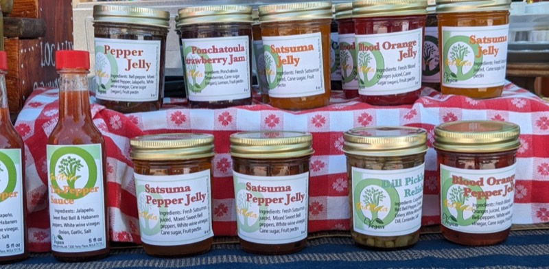 Image of various GroNola Pepper Jellies at the market